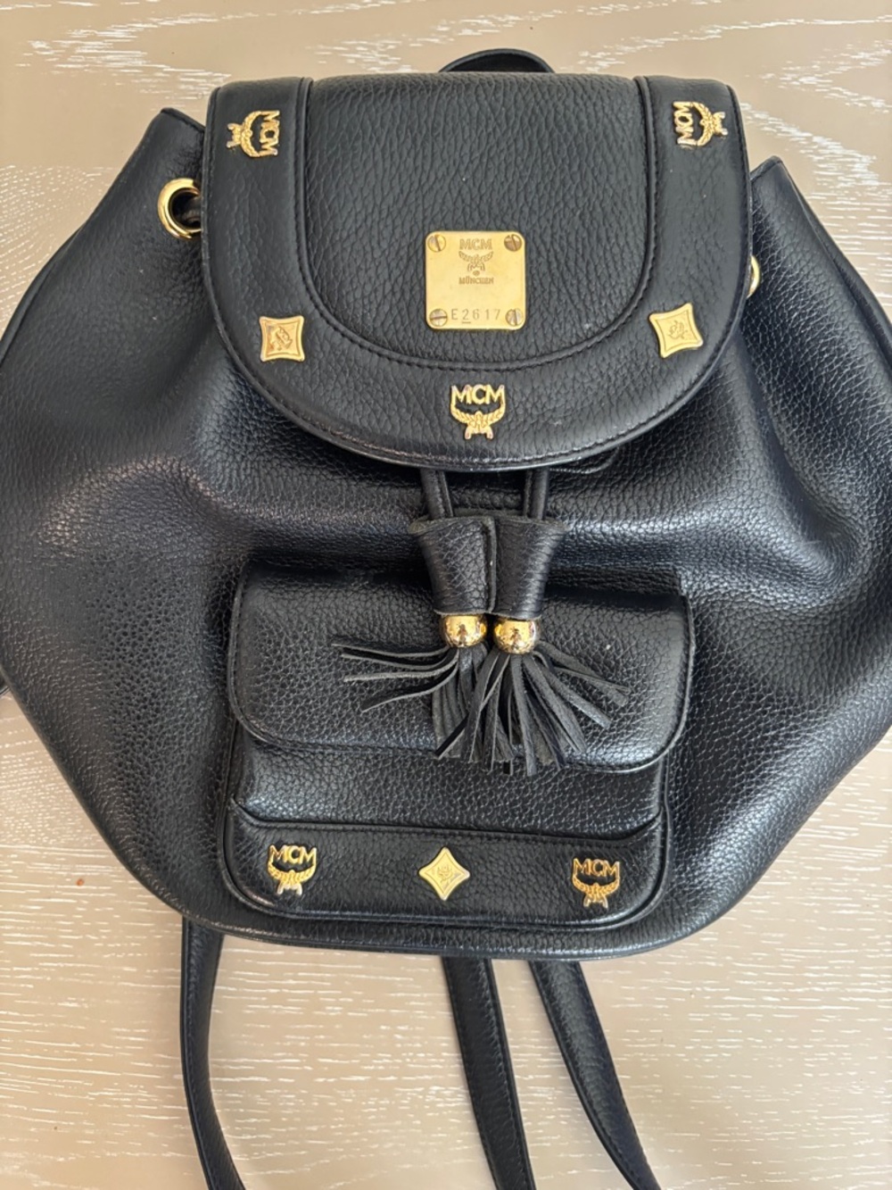 MCM Black Pebbled Leather Tassel Drawstring Backpack with Gold Hardware